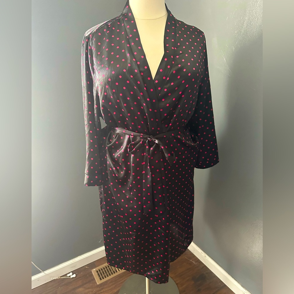 Black robe with pink polka dots